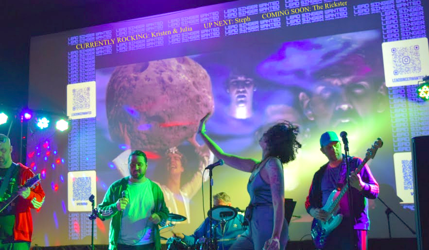 Lead Singer Wanted live band karaoke performance in Pittsburgh PA — audience member singing on stage with a live band and music videos